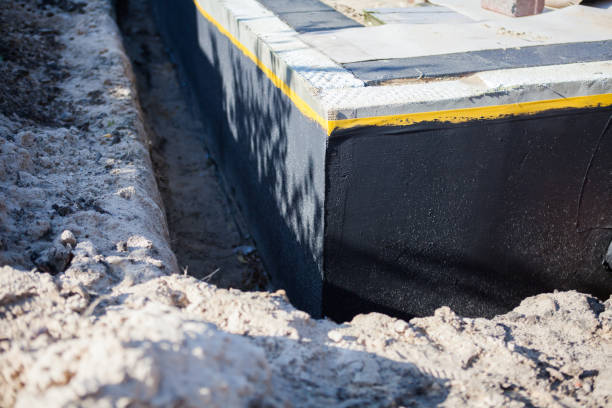 Professional Waterproofing technician working in Walton, IN